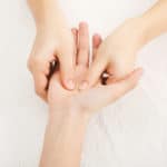 Hand massage. Physiotherapist pressing sp